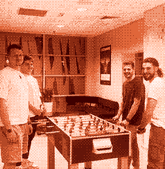 The team around a table football game in the office